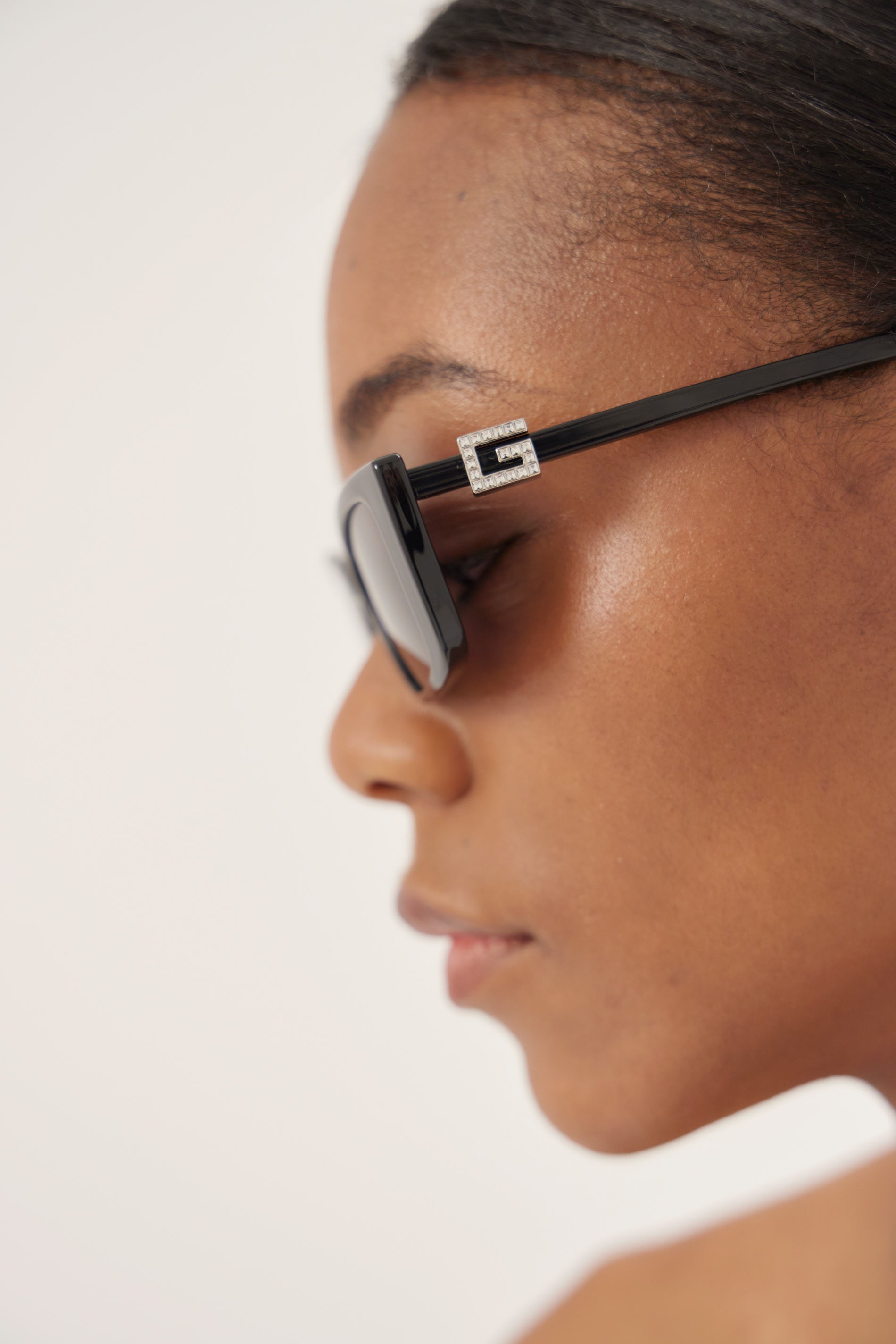 Black cat-eye Gucci sunglasses with silver logo