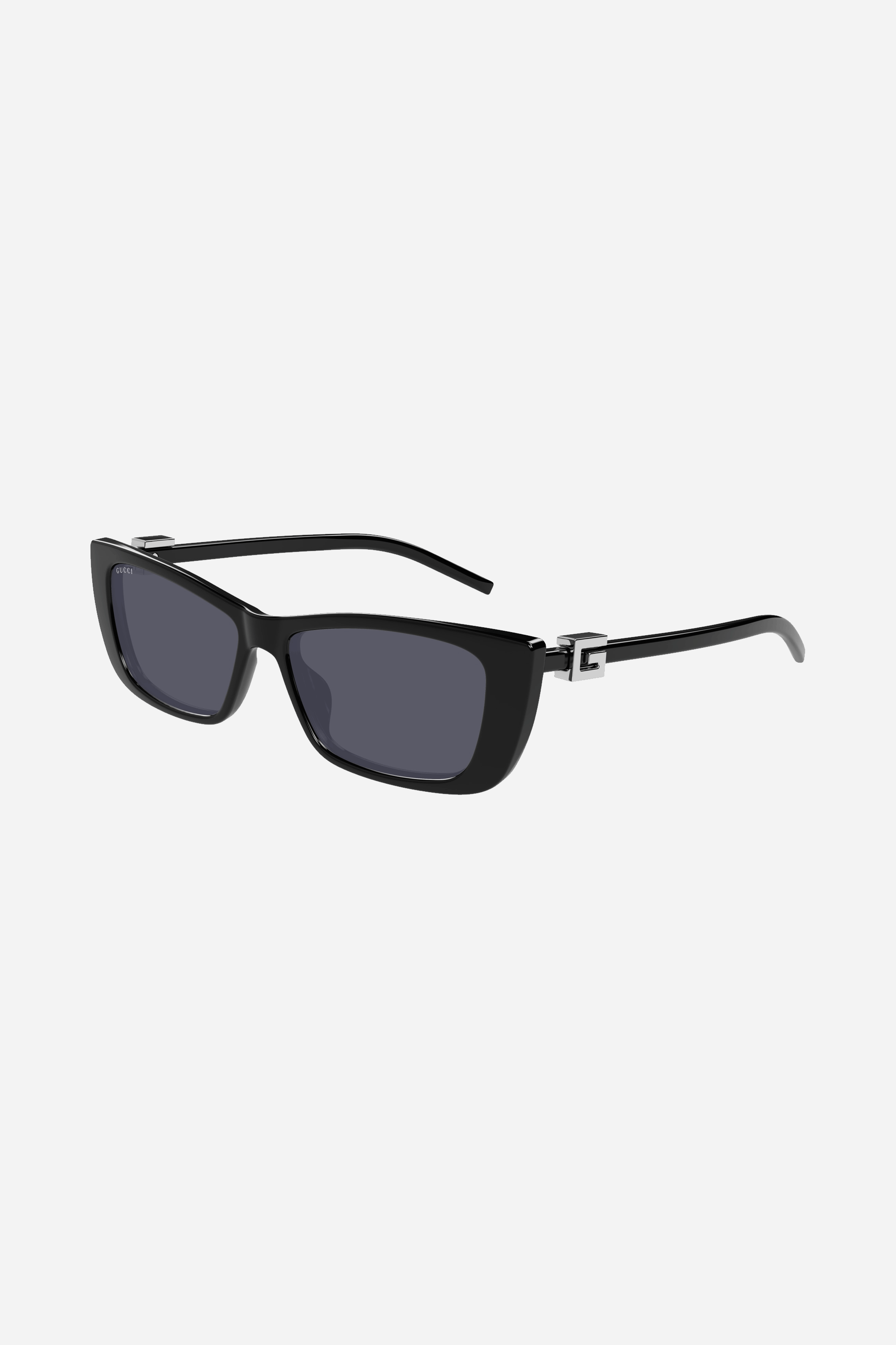Black cat-eye Gucci sunglasses with silver plain logo on the side.